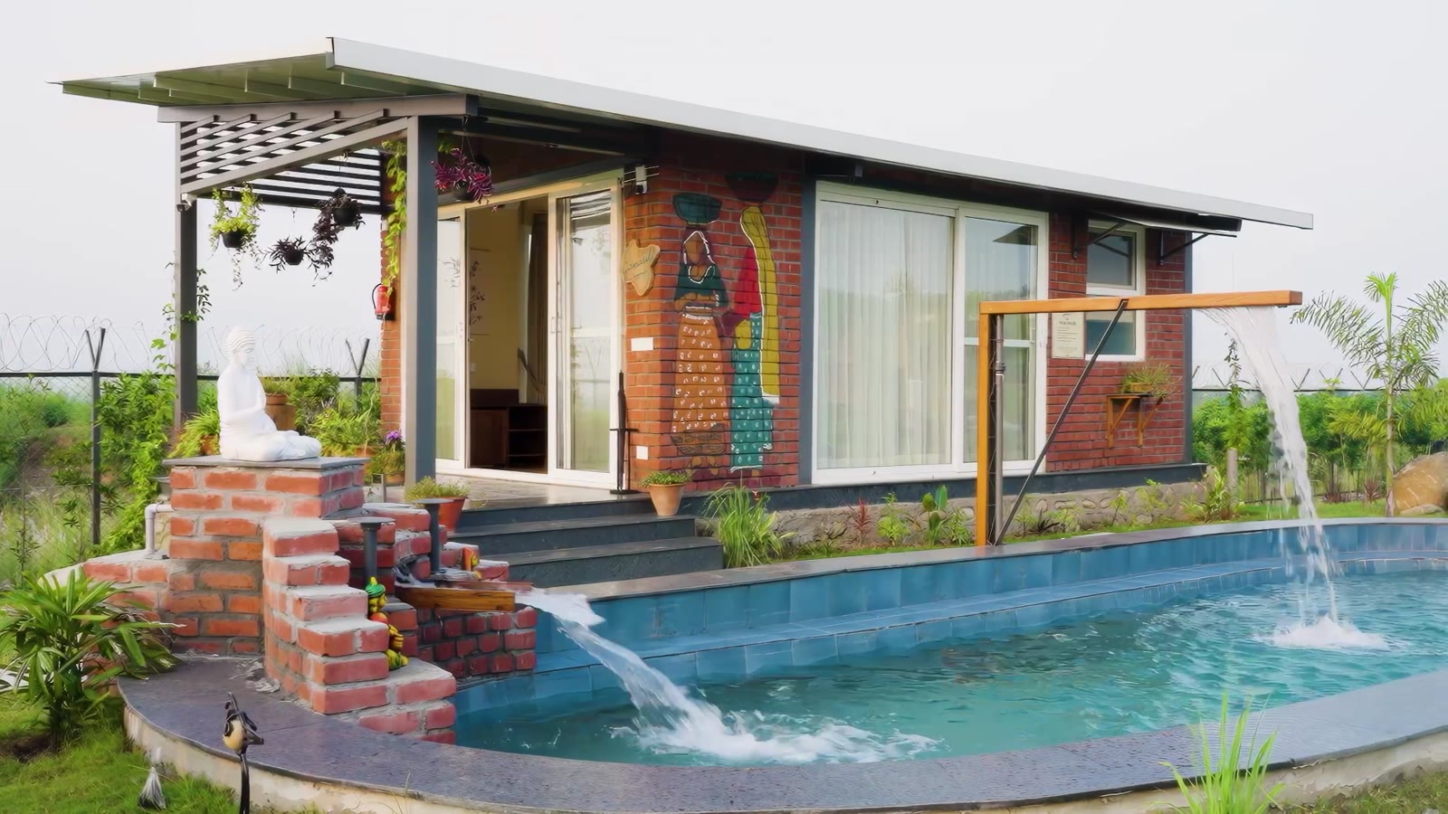Sabr cottage beside a pool, surrounded by green mountains
